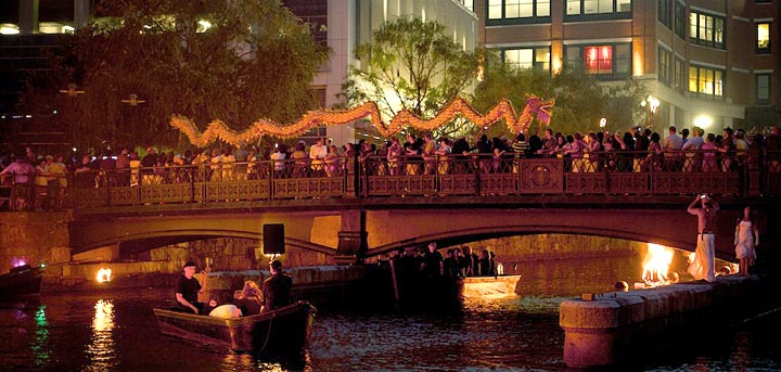 A Chinese dragon delights the crowd in the basin of Waterplace Park. Photo by James Turner.