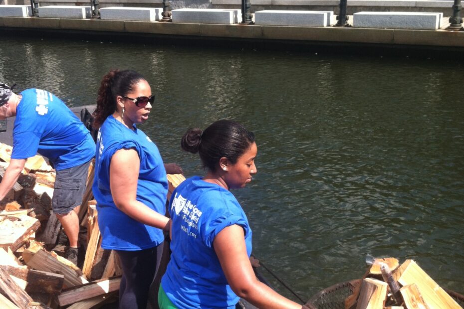 BCBSRI volunteers work on their tans and build their community at WaterFire Providence. Photo by Gary St. Laurent.