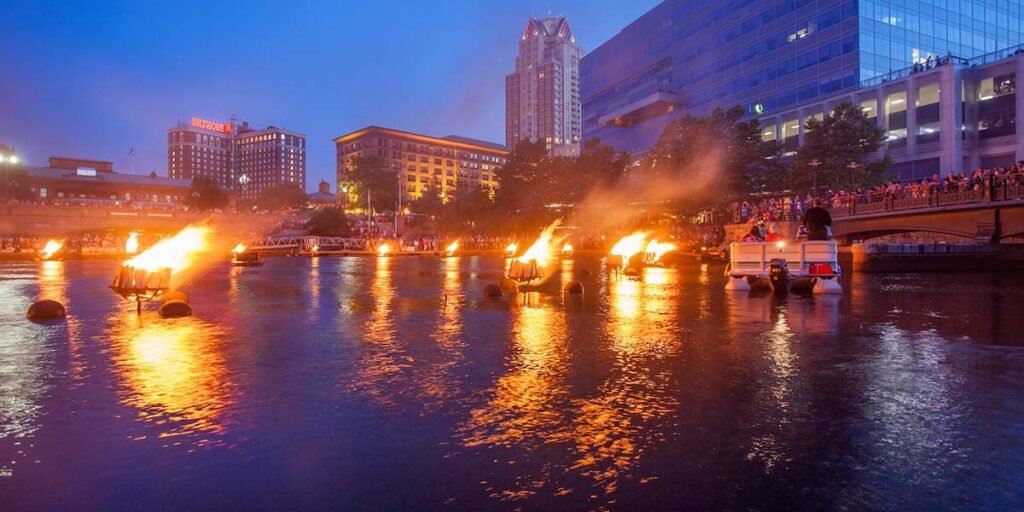 The access boat cruises by fires in the basin.