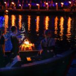 Torches light up Waterplace Basin during a WaterFire lighting. Photograph by Laura Patton.