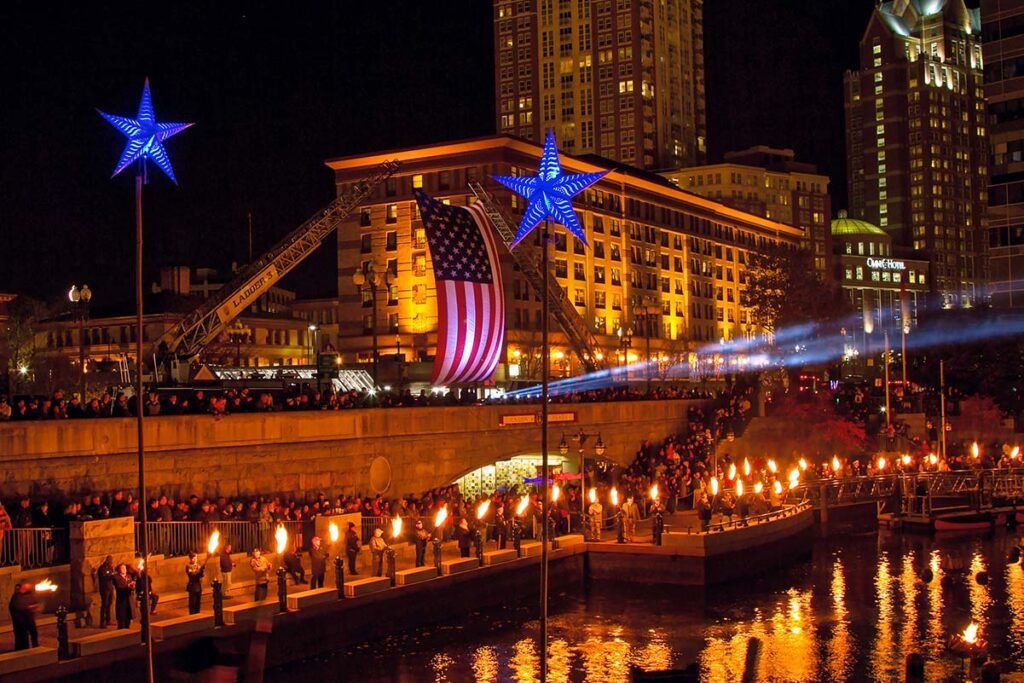 The American Flag flying over Waterplace Basin. Photograph by Max Dowgiallo.