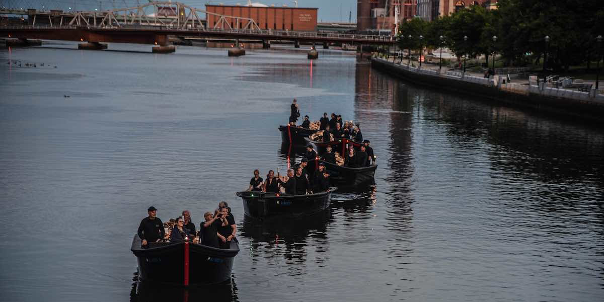 Light boat procession lining up at WaterFire in 2019. Photograph by Luis Andrade.