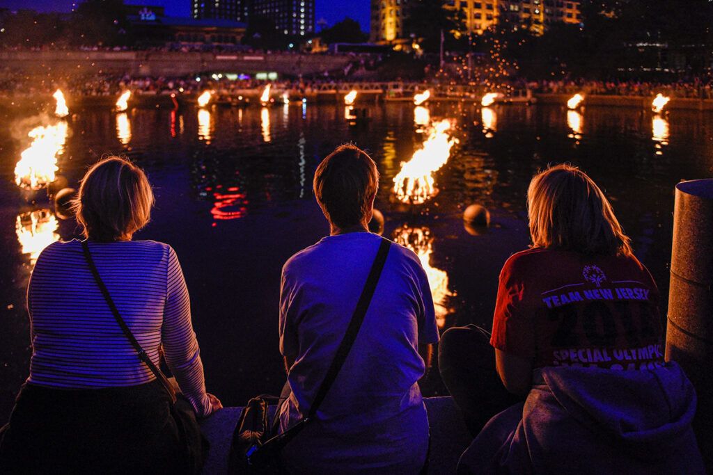 Visitors enjoy the fires at WaterFire. Photograph by Laura Paton.